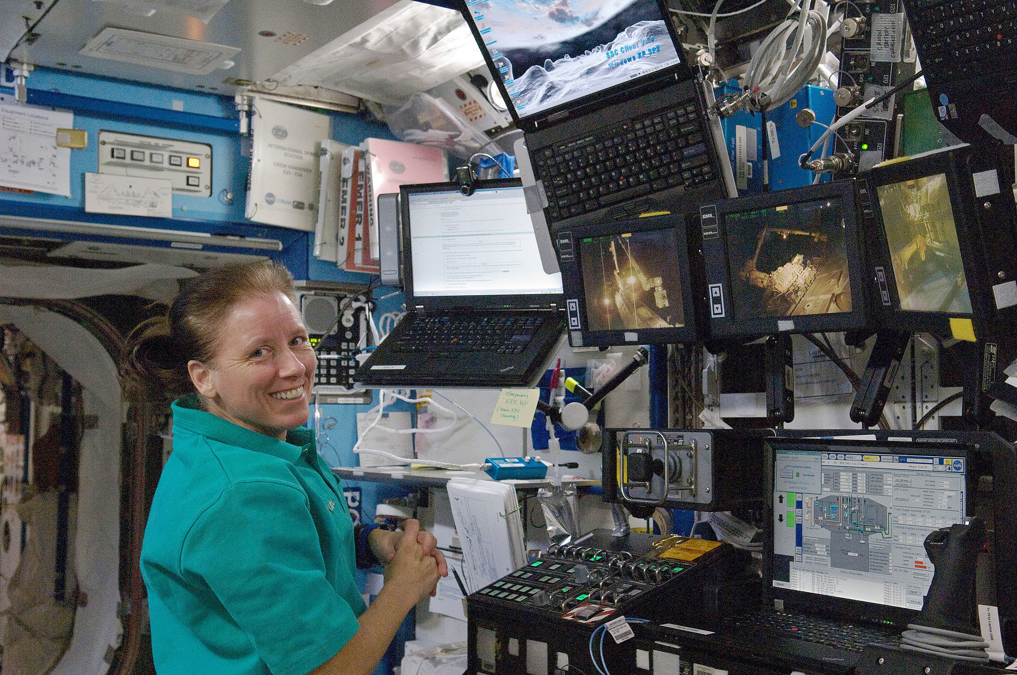 NASA astronaut Shannon Walker, Expedition 24 flight engineer, is pictured near a robotic workstation in the Destiny laboratory of the International Space Station. One day I'll have a workstation as cool as hers. LICENCE: Public Domain.
