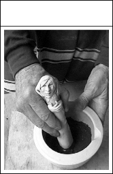 4. Add water and grind with pestle to a powder. (Pestle by Christine Silvester Currie)