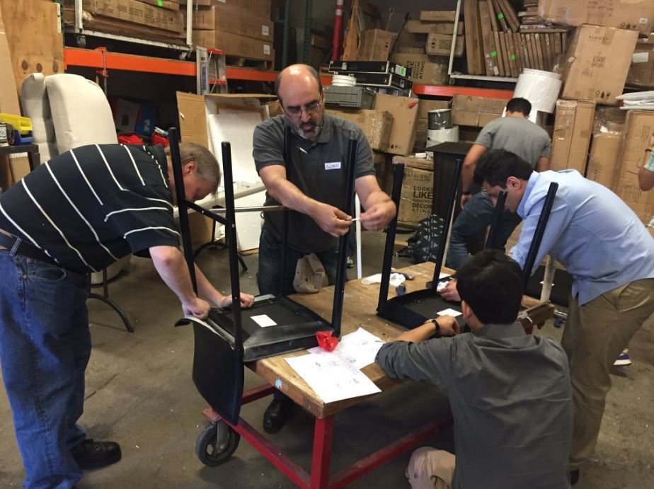 Volunteers assemble furniture at the Habitat for Humanity Restore in Anaheim, California