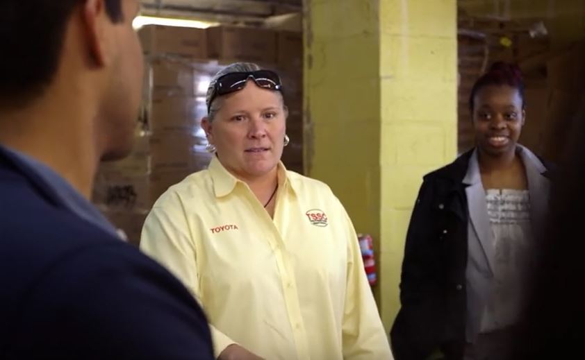 Toyota employees teach Hurricane Sandy food bank staff how to reduce time to distribute food in New York