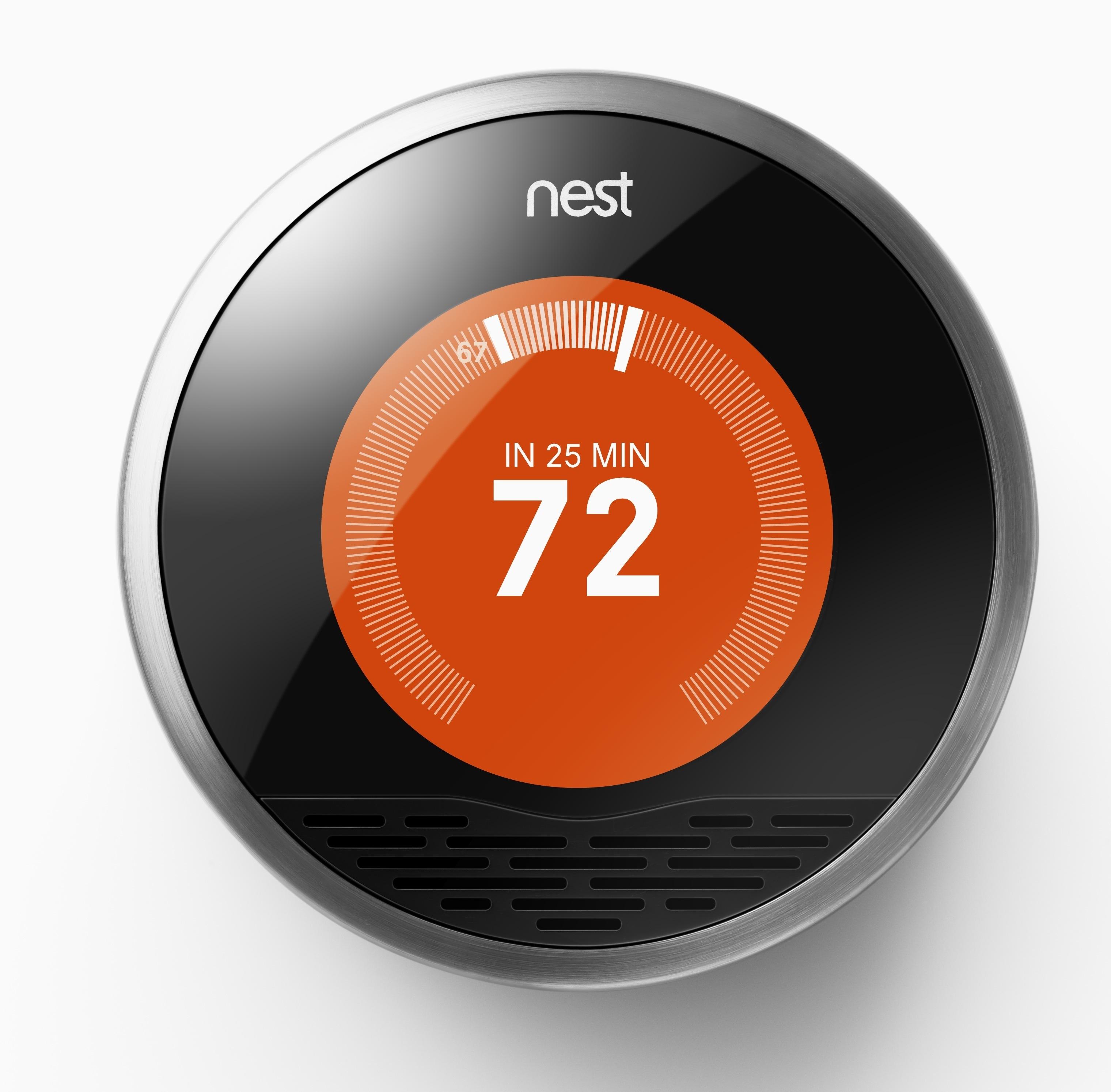 **Figure: Nest Learning Thermostat**. Thermostat Showing Heating. ---Image Credit: Nest Labs.