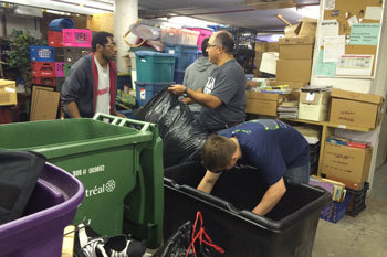 Ricardo Thierry Aguilera and Joel Brock help organize donated clothes at Le Chaînon, a women’s shelter in Montréal, Quebec (Canada), prior to the 2014 IISE Annual Conference.