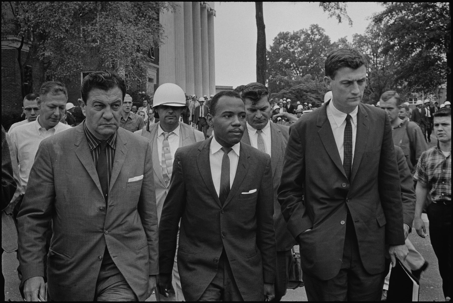James Meredith walks to class at Ole Miss, accompanied by US Marshals