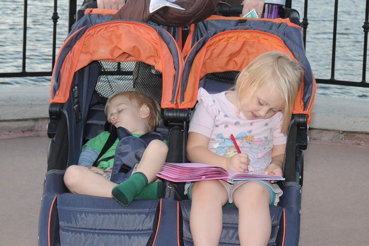 One kid sleeping, one not in double stroller