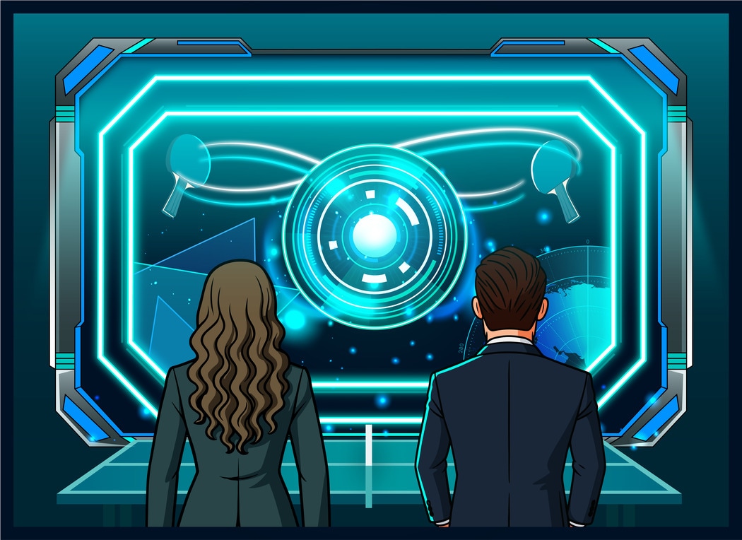 Woman and man looking across ping pong table to diagram on the wall showing ping pong effect